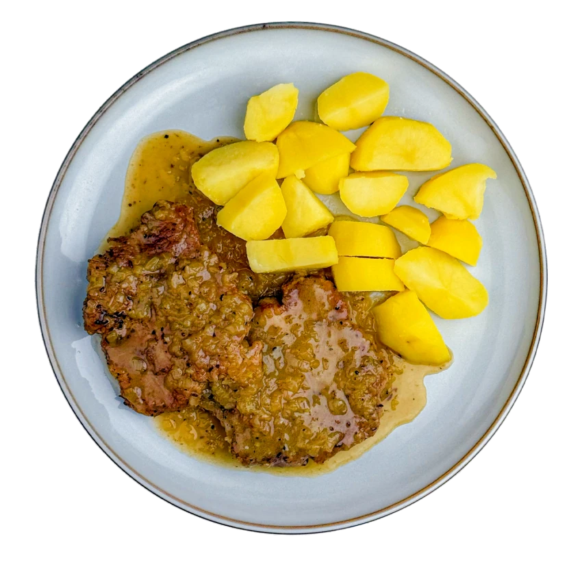 Pork neck with caraway and boiled potatoes