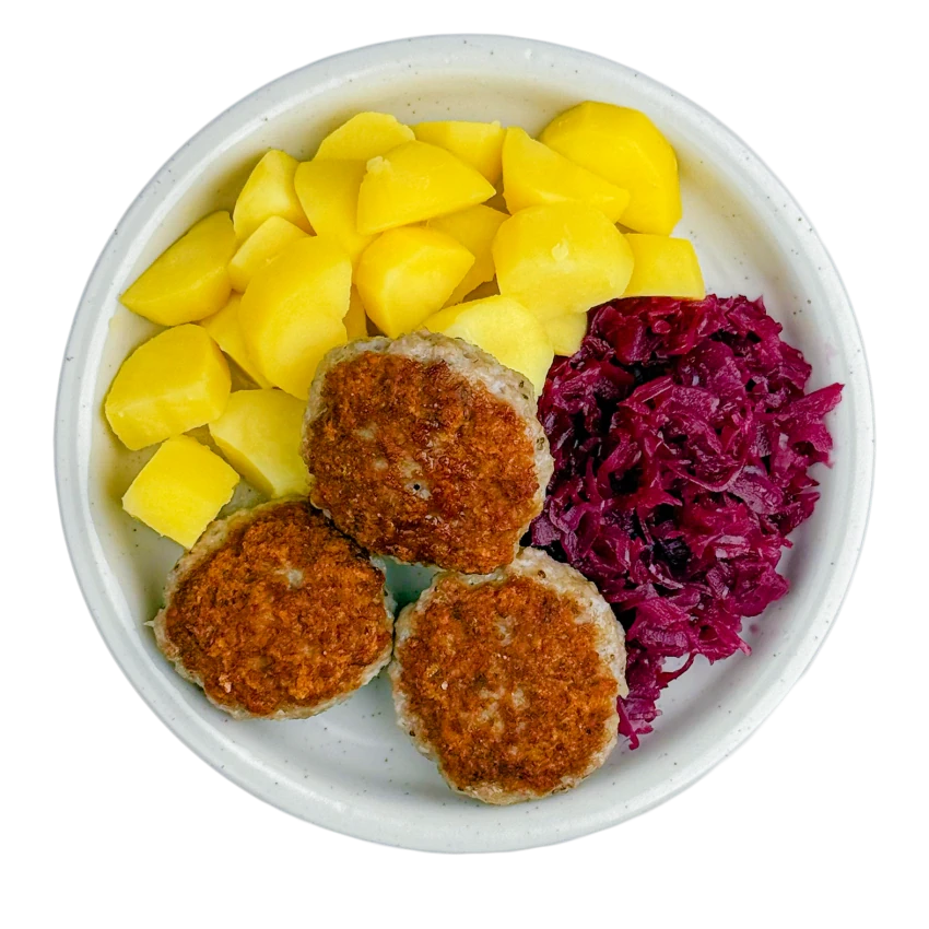 Meat patty with potatoes and red cabbage