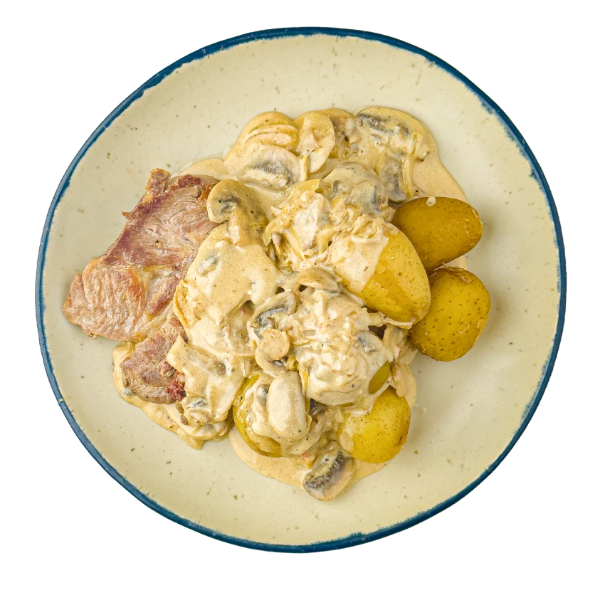 Schnelles Schweinefleisch mit Pilzen und gekochten Kartoffeln