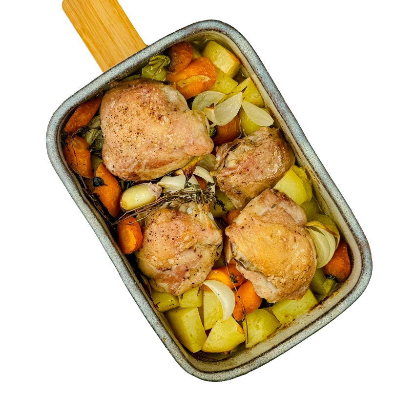 Chicken Roasted in a Deep Roasting Pan with Potatoes and Carrots