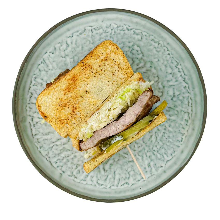 Sandwich with Roasted Pork Neck, Cabbage Salad and Pickled Cucumbers